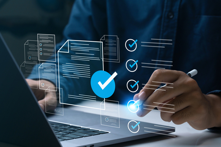 Business performance checklist, Businessman using laptop online survey filling out check digital form task, business performance monitoring and evaluation. online survey question form. online exam. Wellington, Somerset